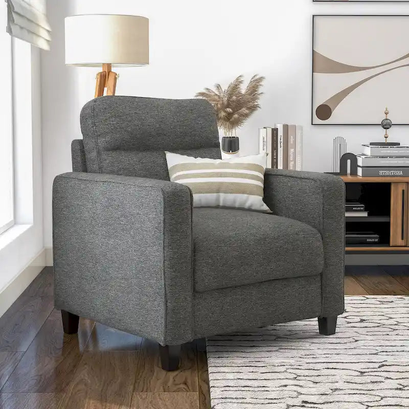 Un fauteuil de style moderne avec des pieds coniques en bois massif et des coussins en tissu ; un canapé individuel.