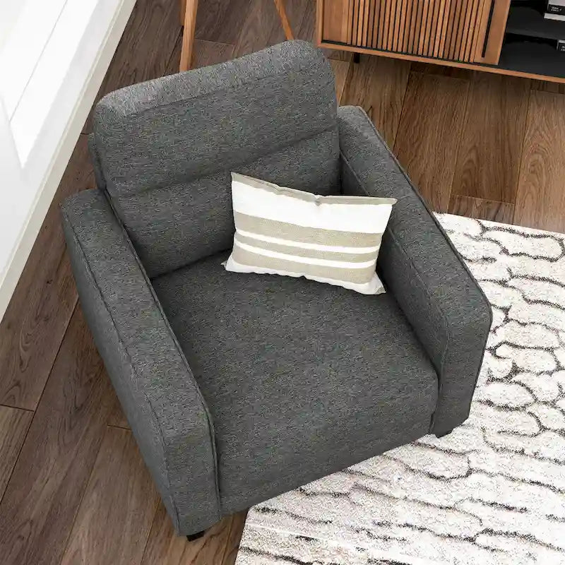 Un fauteuil de style moderne avec des pieds coniques en bois massif et des coussins en tissu ; un canapé individuel.